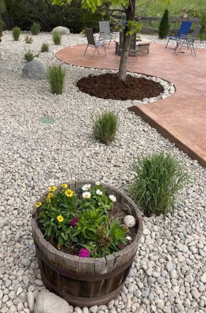 custom paver patio beside gravel