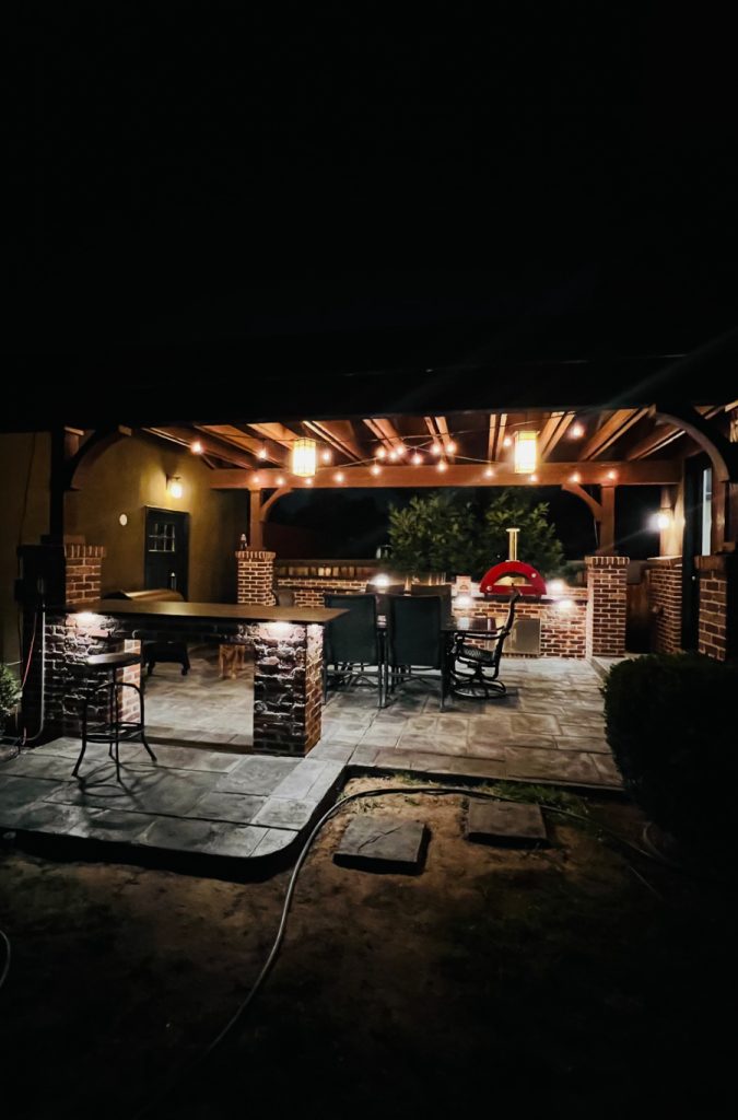 Fancy lighting in outdoor kitchen built by Blue Sky